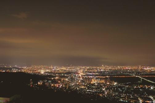 Evening stretch against a backdrop of city lights twinkling in the distance.
