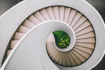 white and brown concrete spiral stairs