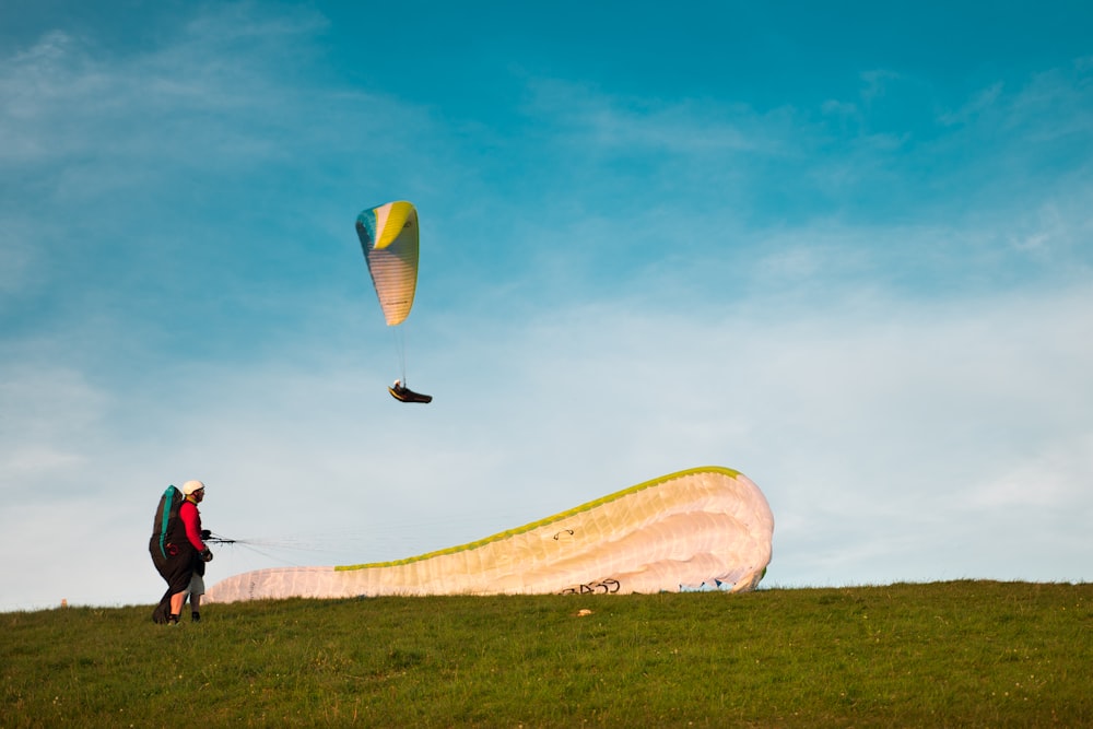 two person parachuting at daytime