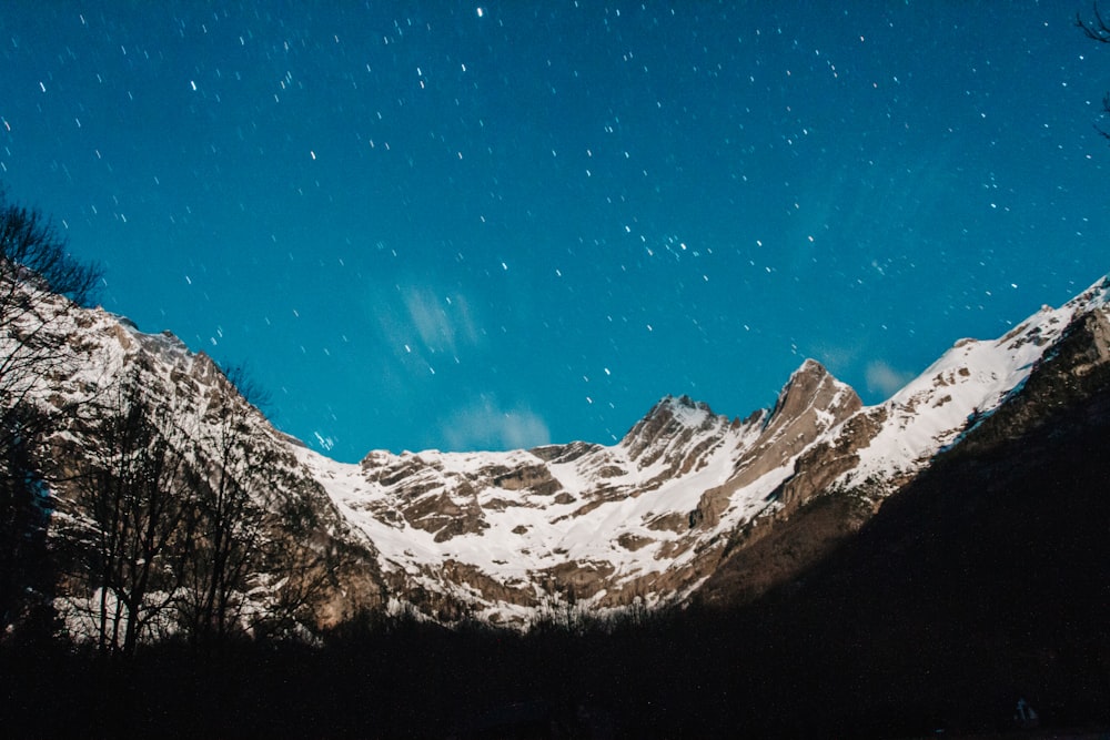 brown mountain under night sky
