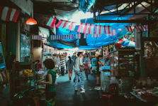 A vibrant local market scene in Sumatera bustling with small business owners and colorful products.