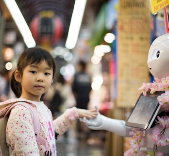 photo of girl laying left hand on white digital robot