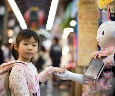 photo of girl laying left hand on white digital robot