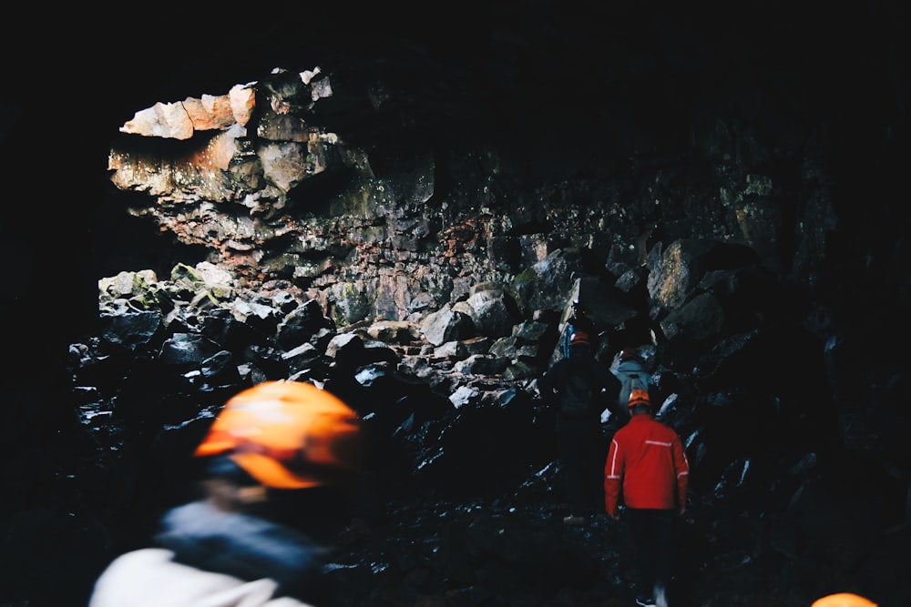 person standing inside the cave
