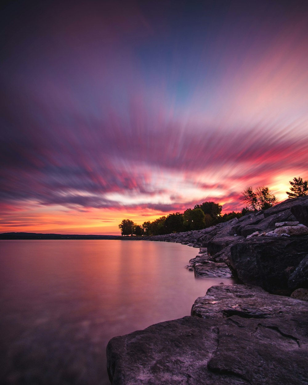 body of water and gray rock formation