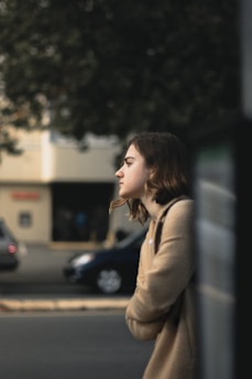 A person standing at a crossroads, looking thoughtful and contemplative.