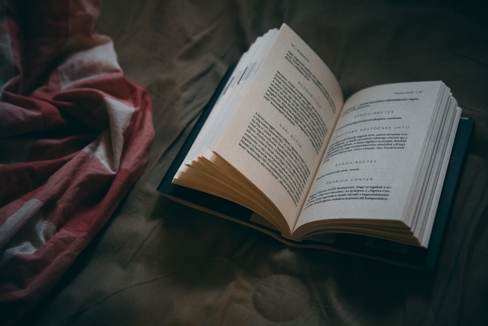 book on brown textile