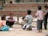 A diverse group of students engaged in a lively discussion outdoors.