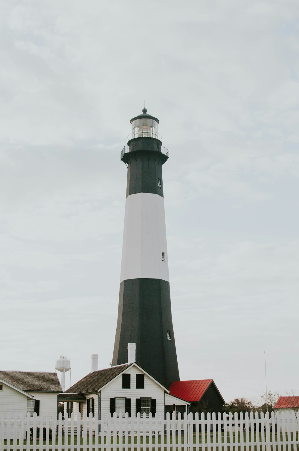 black and white lighthouse low-angle photography at daytime