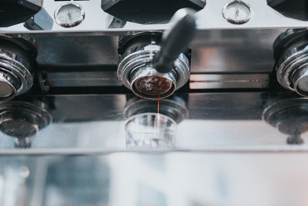 a close up of a machine that has some liquid in it