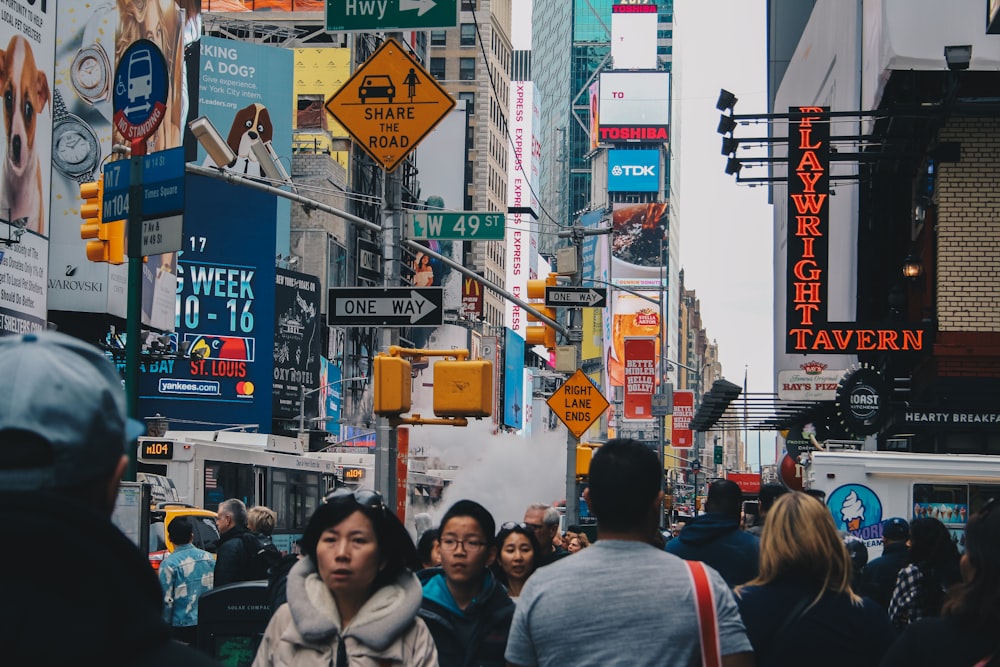 people walking on street near buildings during daytime