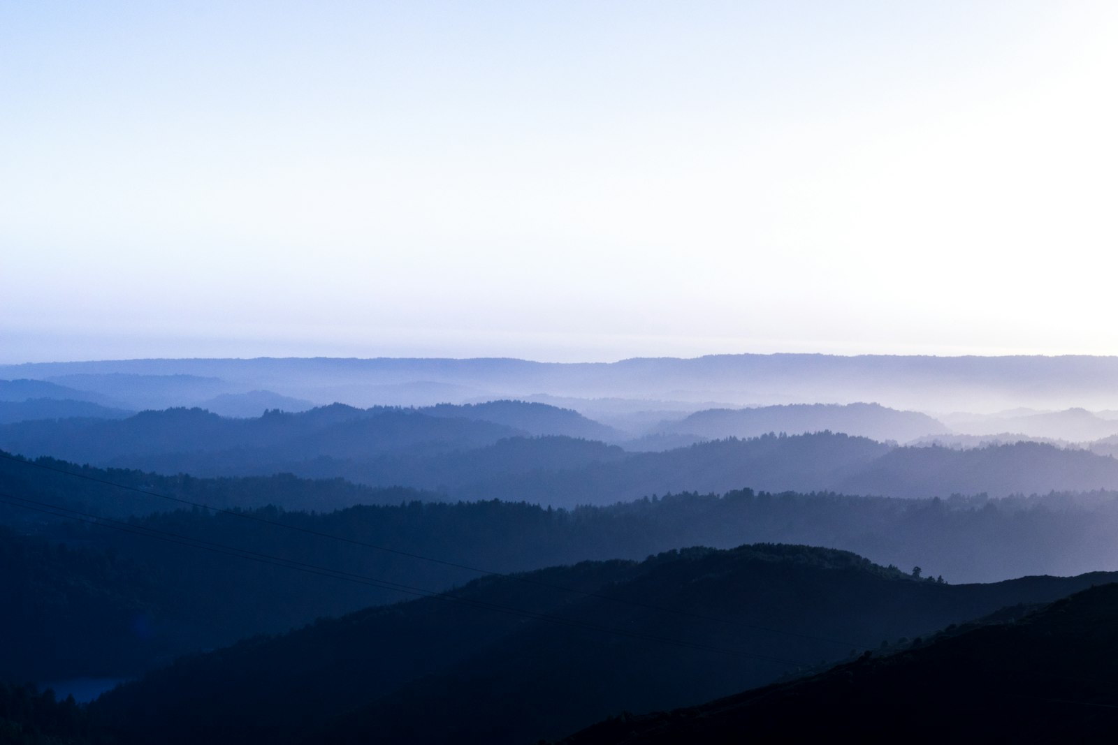 Canon EOS 80D + Canon EF 16-35mm F4L IS USM sample photo. Mountains covered with fog photography