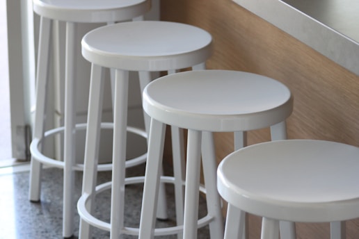 A stylish setup of various bar stools for events.