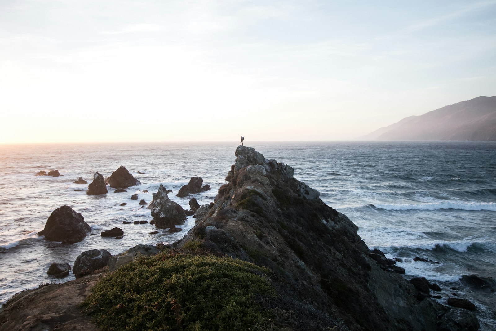 Canon EOS 7D Mark II + Canon EF-S 10-22mm F3.5-4.5 USM sample photo. Person standing on rock photography