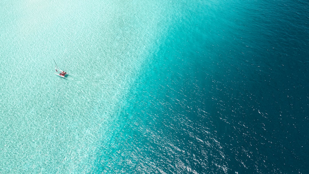boat on body of water, When I was shooting in Summer Island Maldives. the water there is like magic.