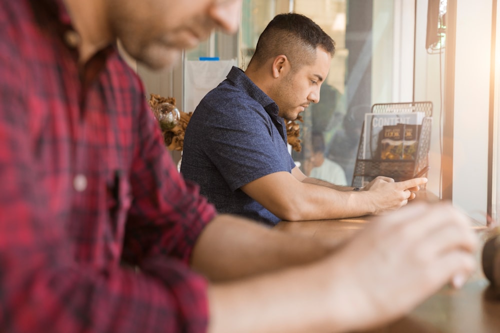 two men sitting near each other