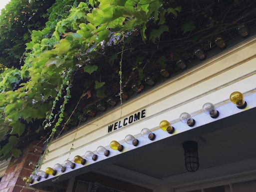 A welcoming front porch of a community center with a Thrive Laurens County banner.