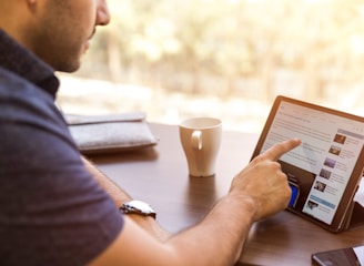 man holding tablet computer