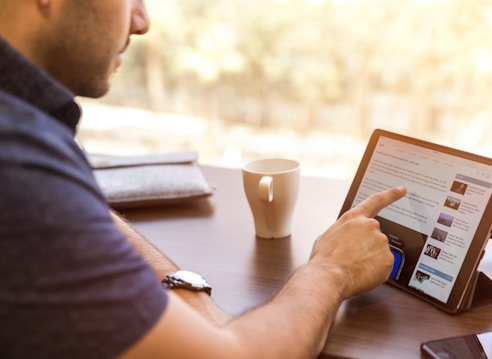 man holding tablet computer