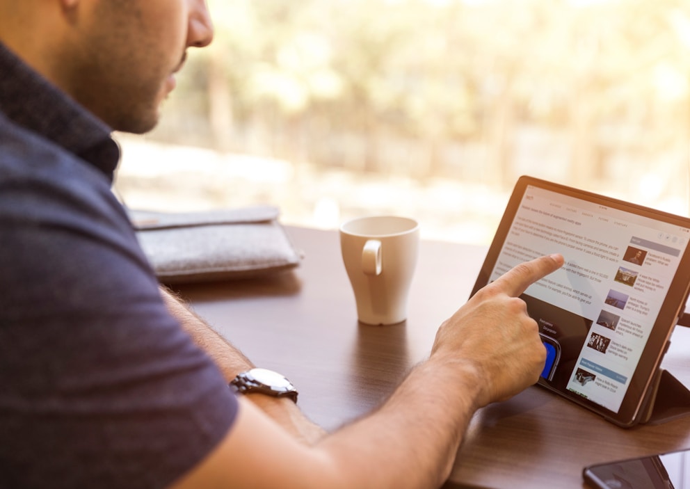 man holding tablet computer