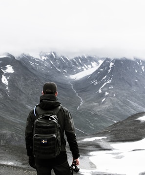 man standing at mountian