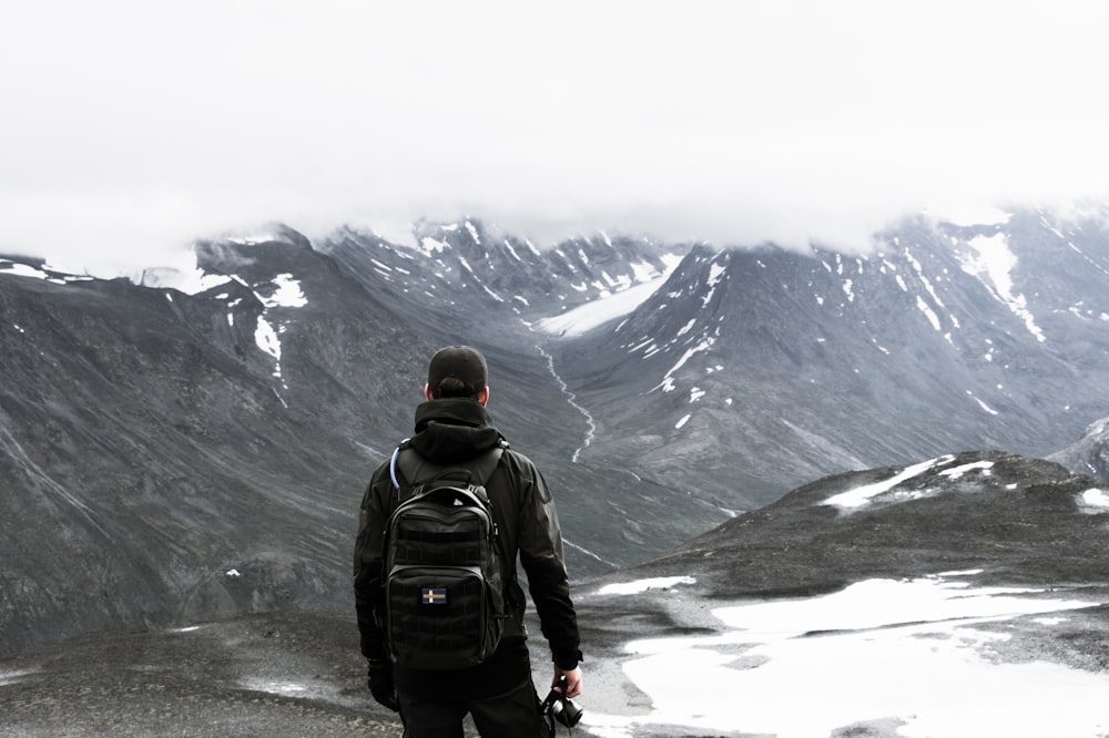 man standing at mountian