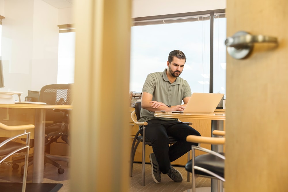 man sitting near desk