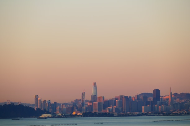 Elegant aerial view of Miami's skyline at dusk with soft light highlighting luxury buildings.