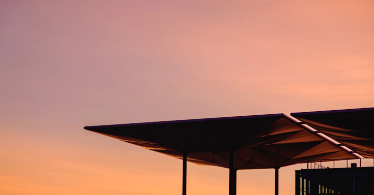 Elegant rooftop silhouette at sunset highlighting luxury craftsmanship.
