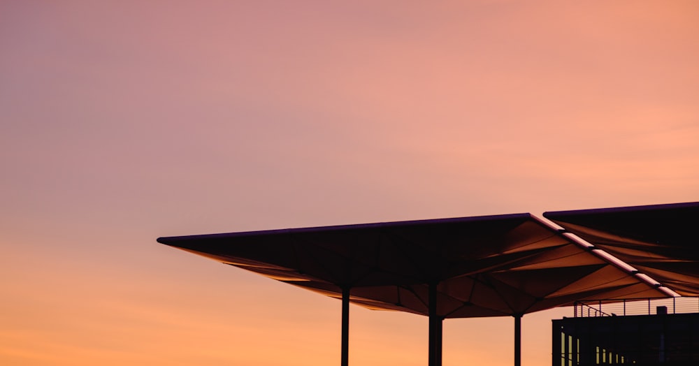 house roof under red sky