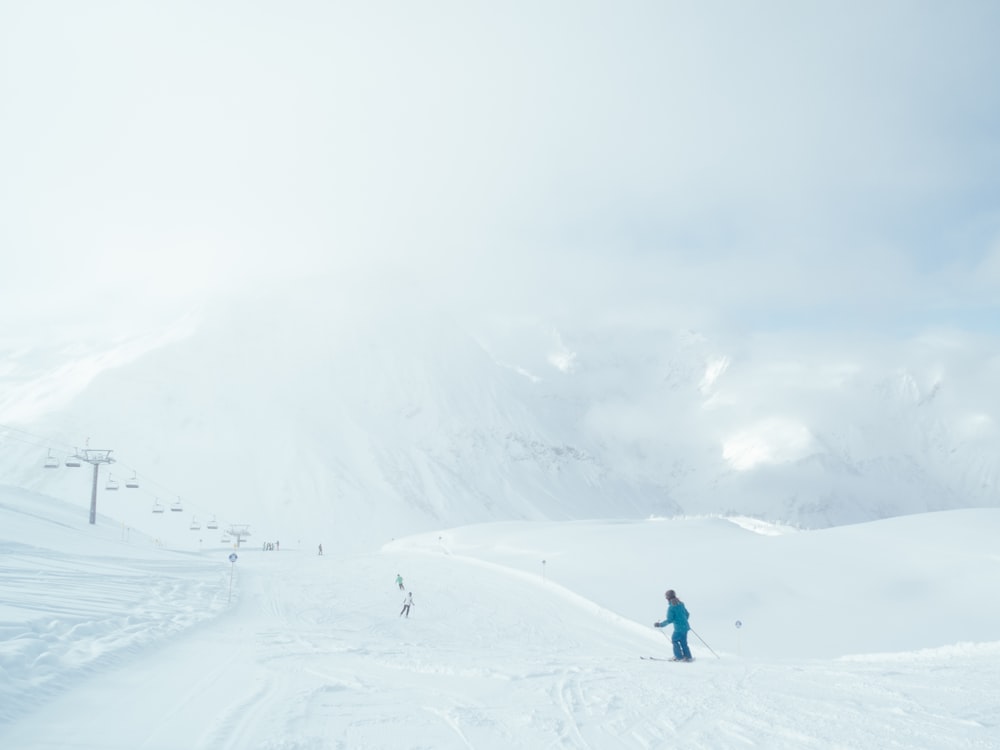 person walking on the snowy field