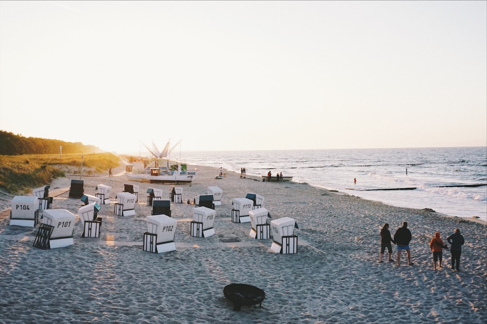 people on sea shore during daytime