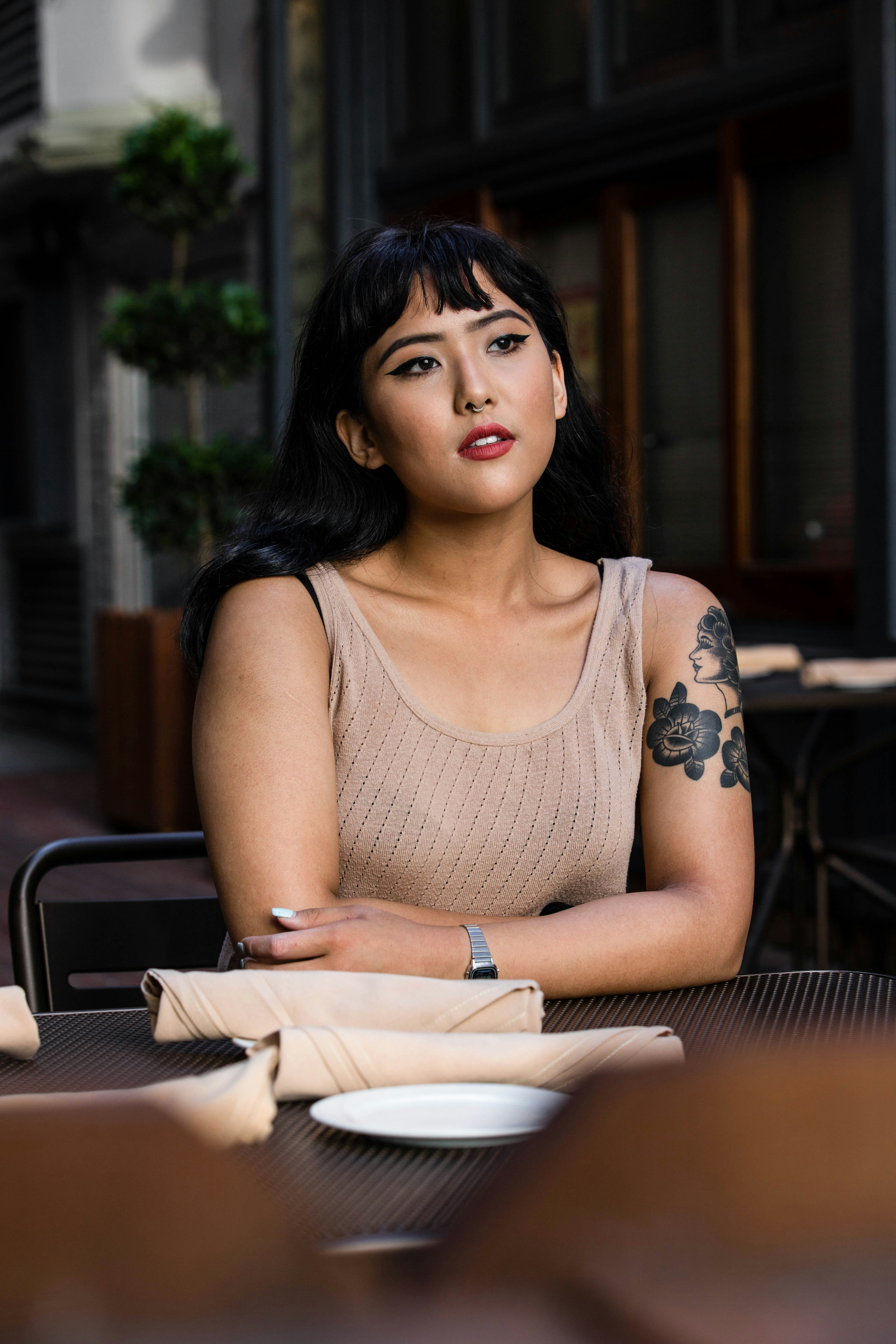 great photo recipe,how to photograph my instagram: @albertdera
 model’s instagram: @chelseaclaire; woman wearing brown tank top leaning on black wooden table with white ceramic plate