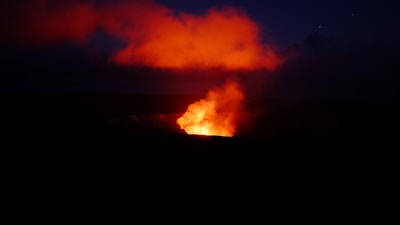 A dramatic night scene with lava flows illuminating a battle site from a notable 2b2t event.