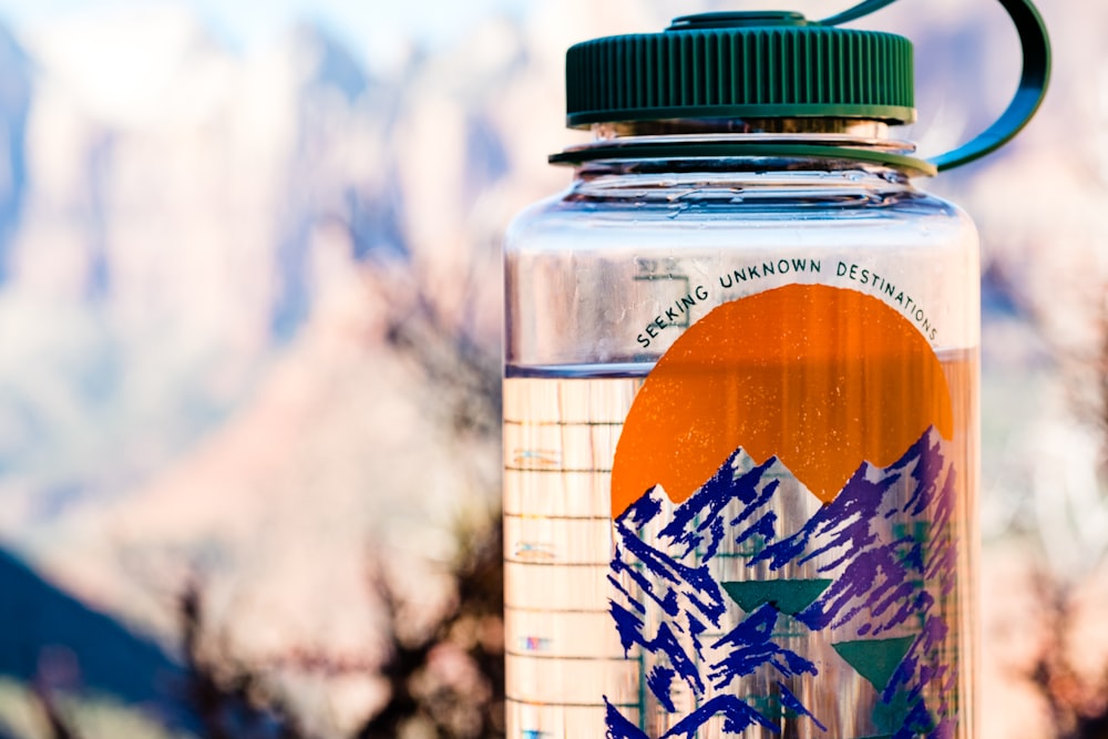 close up photo of clear plastic tumbler with green lid