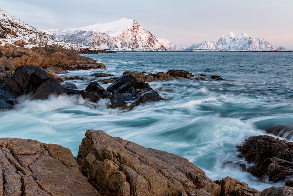 rock formation on body of water