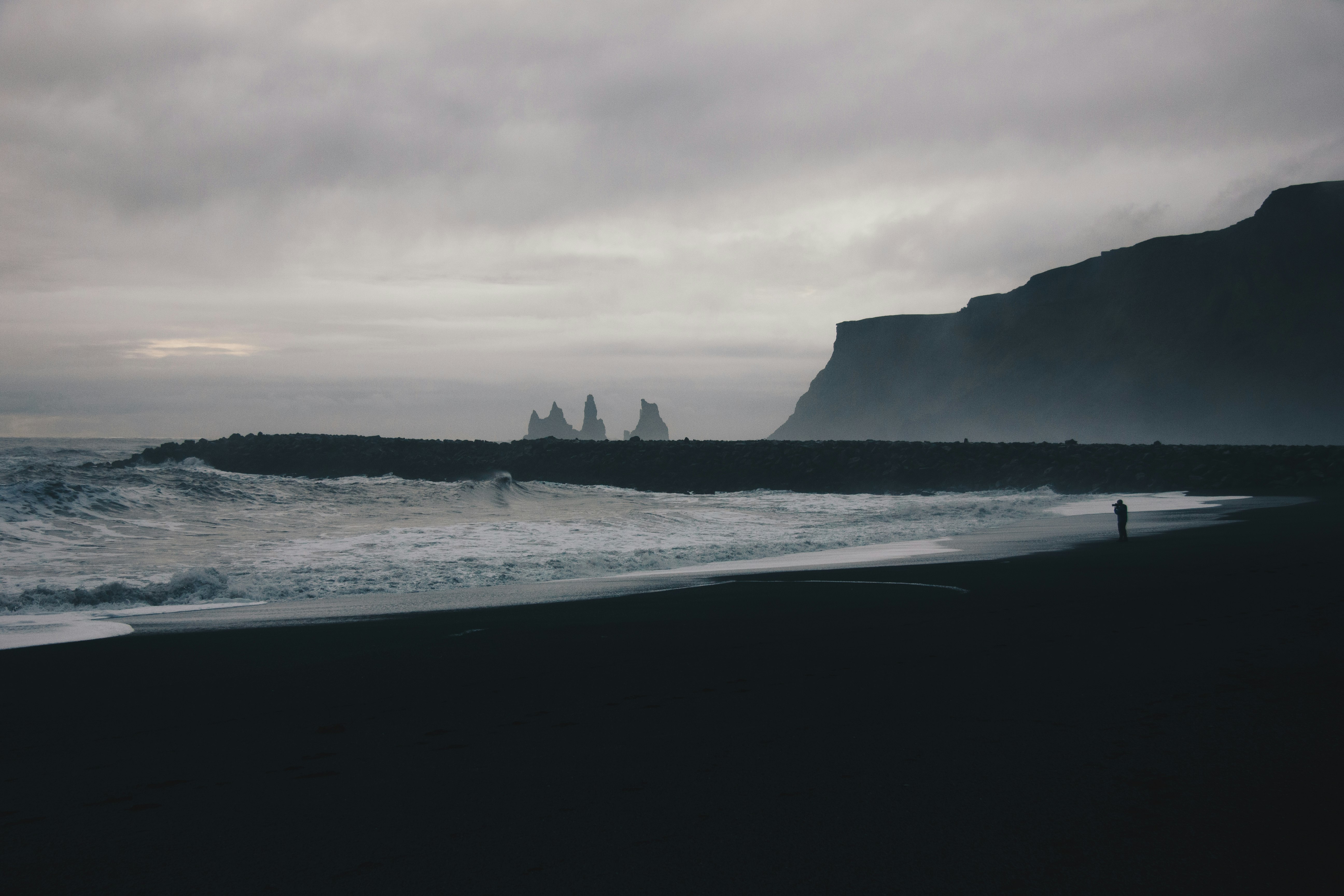 person walking at shore