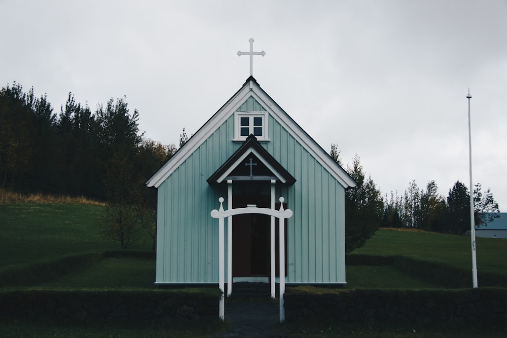 photography of green and white chapel during daytime