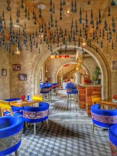 A vibrant café interior with cozy seating and creative decor.