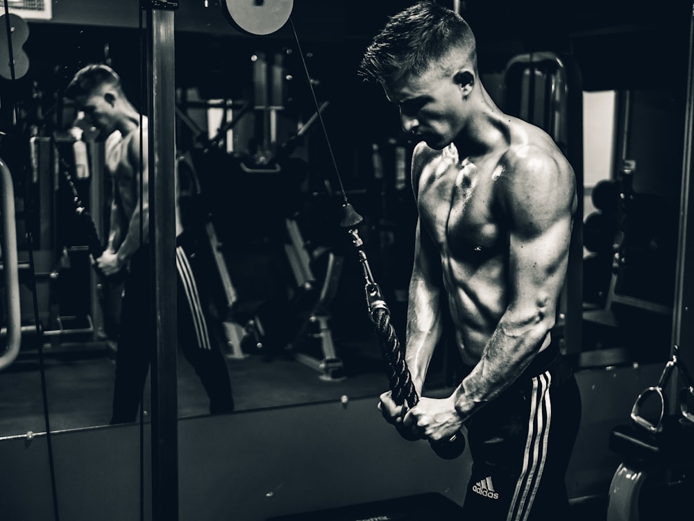 grayscale photo of man exercising