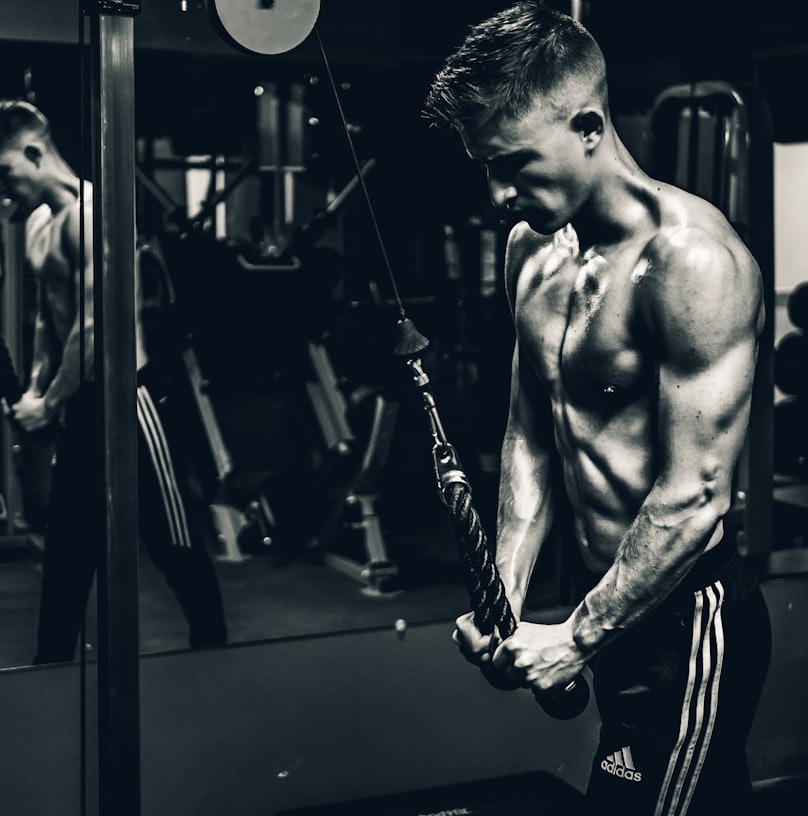 grayscale photo of man exercising
