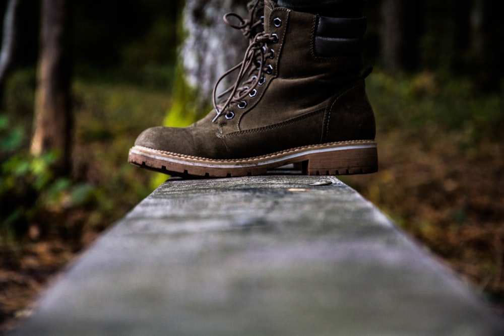 low angle photo of pair of brown suede work boots