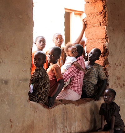 children sitting on window