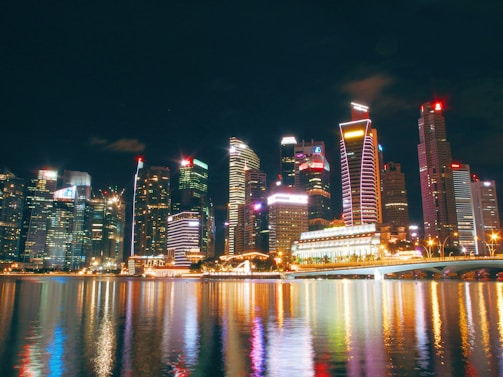 A vibrant city skyline at night, showcasing urban travel destinations.