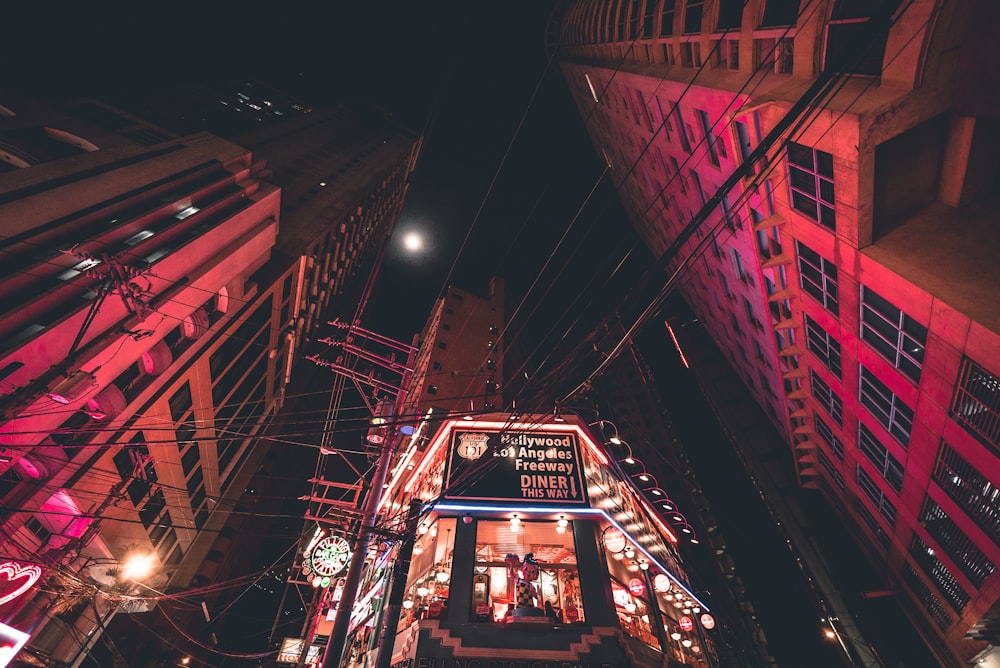 worm's eye view of concrete buildings and electrical wires