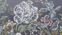 Close-up of a detailed gothic illustration featuring dark florals and intricate linework.