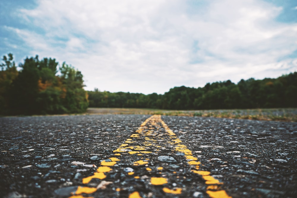 a yellow line on the middle of a road