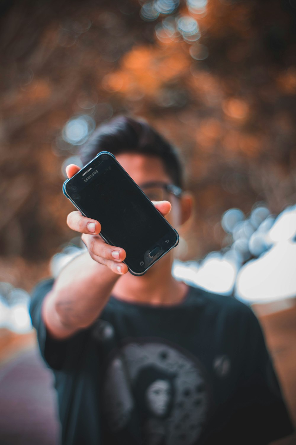 person showing black Samsung Galaxy Android smartphone