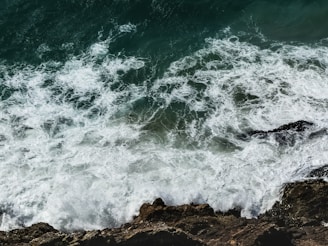 sea waves crashing on rock