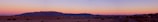 Panoramic view of the Anti-Atlas mountains surrounding Agadir at sunset.